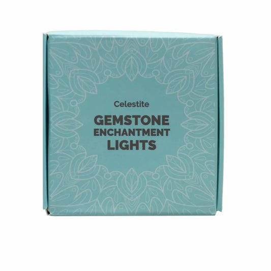 "Celestite Crystal Lights ice blue square box with white decoration and black writing on white background"