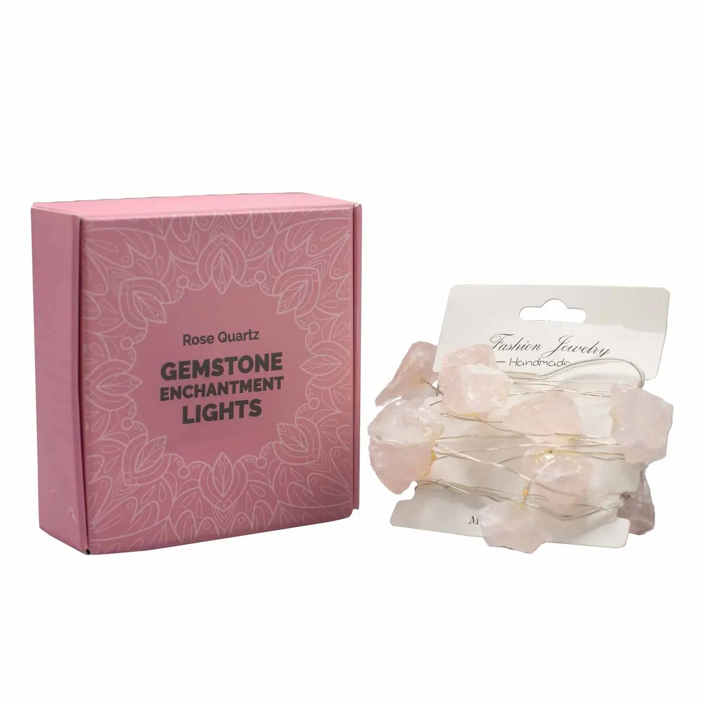 "Rose Quartz Crystal Lights on card wrap showing rose pink crystals in front of pink box on white background"