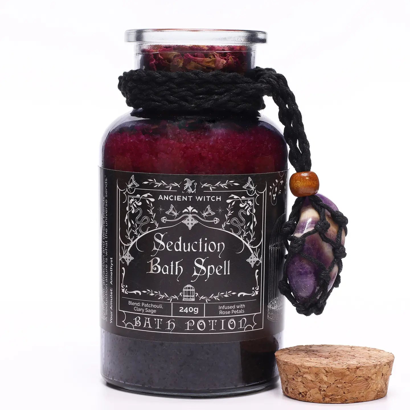 "Seduction" Bath Spell glass jar with cork lid and macrame necklace with Amethyst crystal on white background"